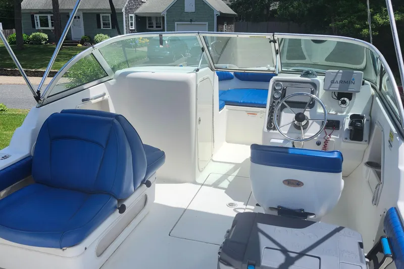 Slide: The Image of 2006 Hydra-Sports 202 DC boat interior with blue seating and Garmin navigation system. - 7