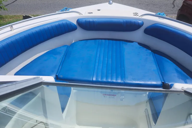Slide: The Image of 2006 Hydra-Sports 202 DC boat interior with blue cushioned seating. - 8