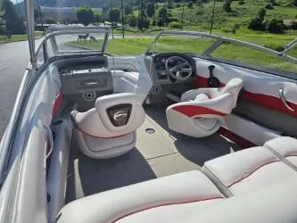 Slide: The Image of 2008 Crownline 19 SS boat interior with plush seating and modern dashboard. - 7