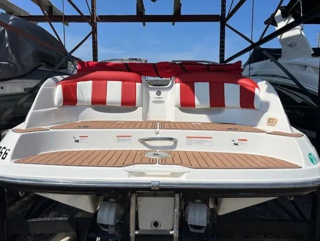 Slide: The Image of 2008 Yamaha Boats SX230 HO with red and white seating, docked under blue sky. - 3