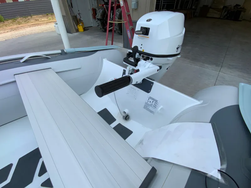 Slide: The Image of Gala A300 boat, 2026 model, featuring a modern outboard motor in a garage setting. - 7