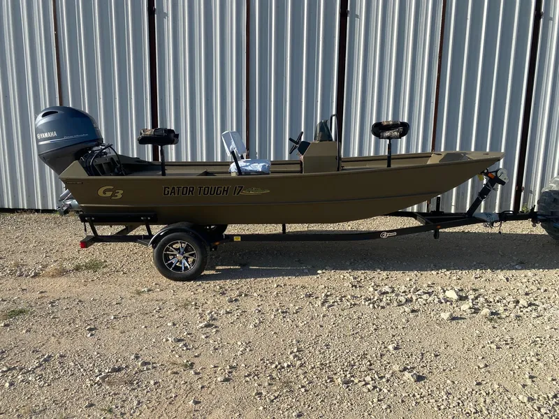 The Image of 2025 G3 Gator Tough 17 CCJ boat on trailer, parked outdoors. - 0