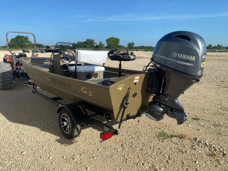 Slide: The Image of 2025 G3 Gator Tough 17 CCJ boat with Yamaha engine on a trailer. - 2