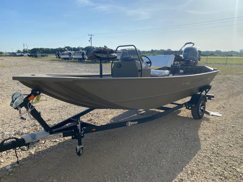 Slide: The Image of 2025 G3 Gator Tough 17 CCJ boat on trailer in outdoor setting. - 3