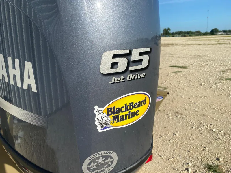 Slide: The Image of Yamaha 65 Jet Drive engine with BlackBeard Marine sticker on G3 Gator Tough 17 CCJ, 2025 model. - 4
