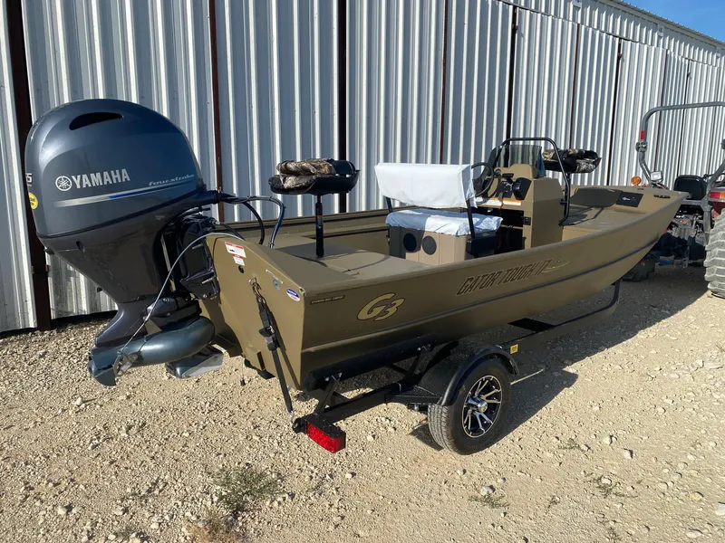 Slide: The Image of 2025 G3 Gator Tough 17 CCJ boat with Yamaha outboard motor, parked on gravel. - 5