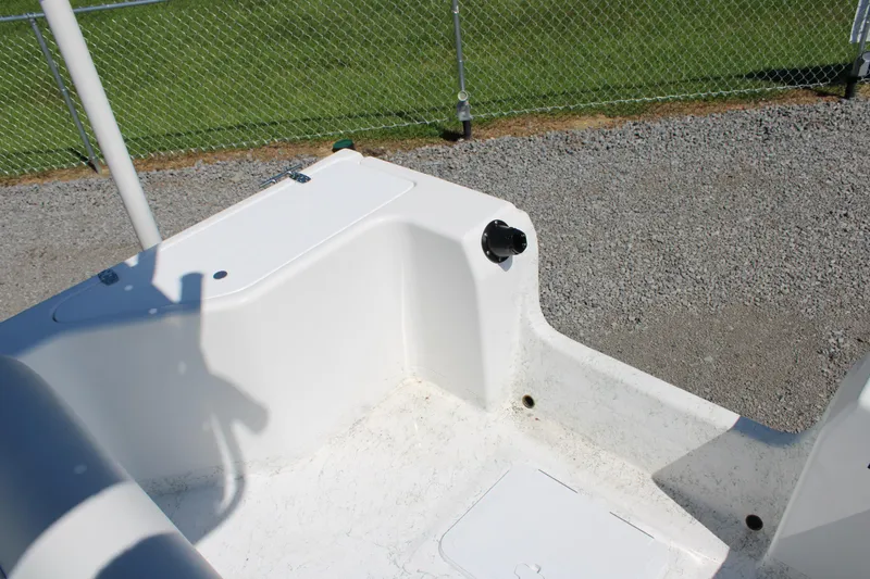 Slide: The Image of 2025 C-Hawk 19CC boat interior, featuring white seating and storage compartments. - 16