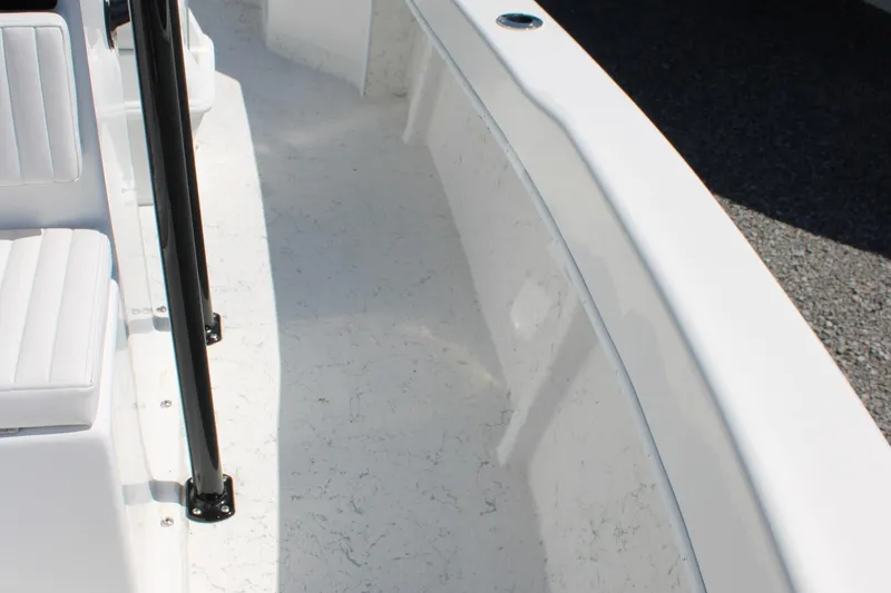 Slide: The Image of 2025 C-Hawk 19CC boat interior with white seating and sleek design. - 19