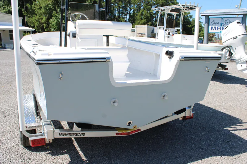 Slide: The Image of 2025 C-Hawk 19CC boat on trailer, rear view, in outdoor setting. - 4