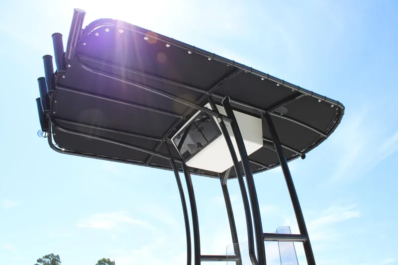 Slide: The Image of 2025 C-Hawk 19CC boat canopy against a clear blue sky. - 13