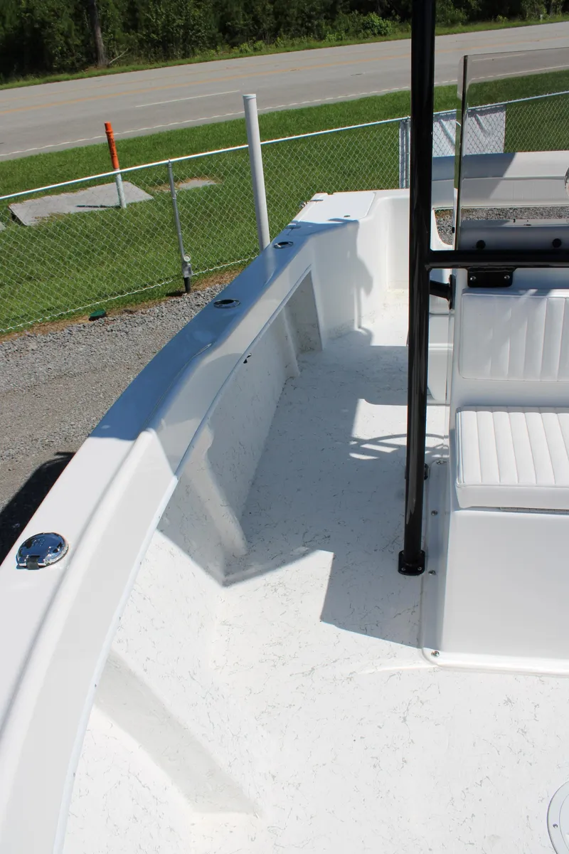 Slide: The Image of 2025 C-Hawk 19CC boat interior with white seating and open deck. - 19