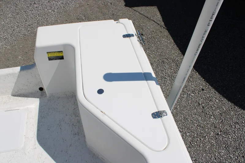 Slide: The Image of 2025 C-Hawk 19CC boat deck with storage compartment and pipe detail. - 20