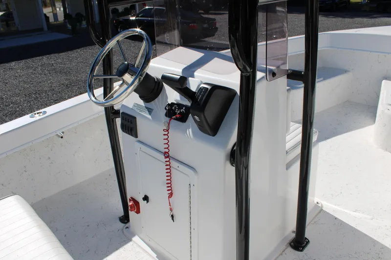 Slide: The Image of 2025 C-Hawk 19CC boat console with steering wheel and controls. - 29