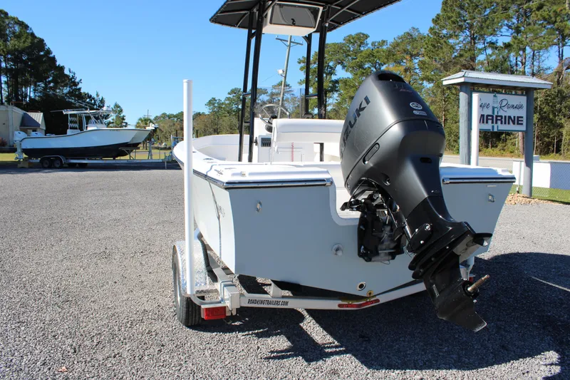 Slide: The Image of 2025 C-Hawk 19CC boat with Suzuki outboard motor on a trailer. - 3