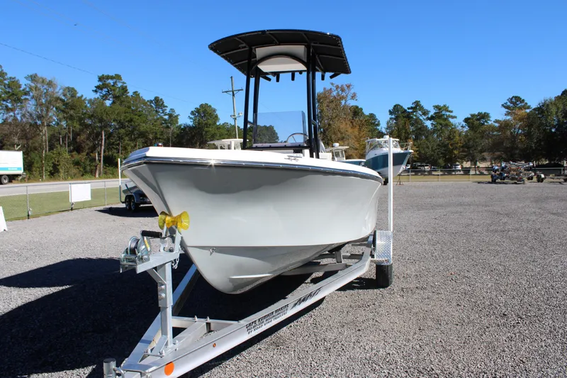 Slide: The Image of 2025 C-Hawk 19CC boat on trailer in outdoor lot, clear sky background. - 32