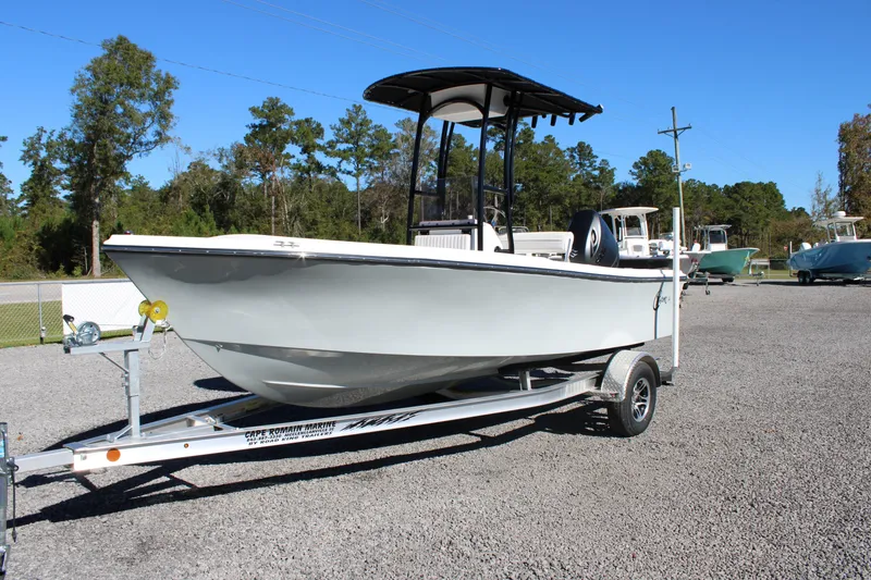 Slide: The Image of 2025 C-Hawk 19CC boat on trailer, parked outdoors under clear blue sky. - 33