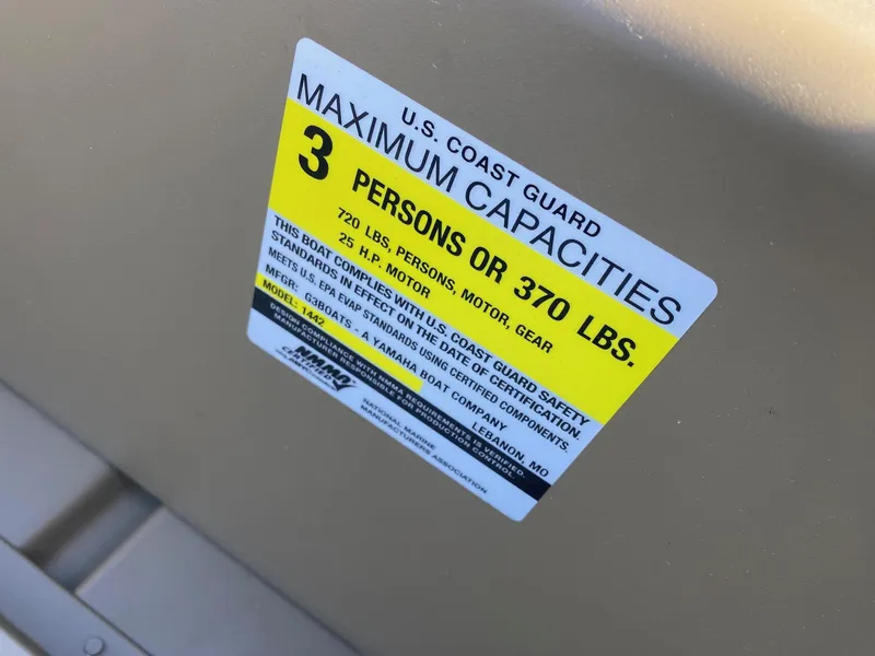 Slide: The Image of 2025 G3 Gator Tough 1442 boat capacity label, 3 persons or 370 lbs limit. - 7