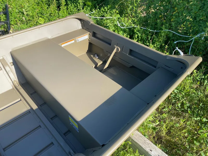 Slide: The Image of 2025 G3 Gator Tough 1442 boat interior, surrounded by greenery. - 8