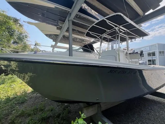 Slide: The Image of 2023 Parker 21SE Center Console boat displayed outdoors on a stand. - 0