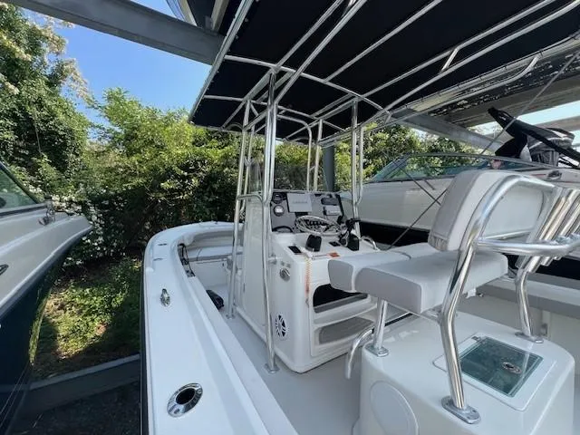 Slide: The Image of 2023 Parker 21SE Center Console boat with sleek design and modern controls. - 13