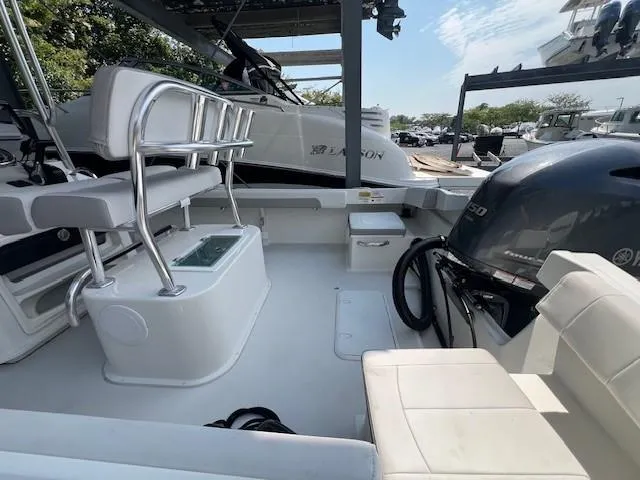 Slide: The Image of 2023 Parker 21SE Center Console boat interior with seating and engine view. - 14