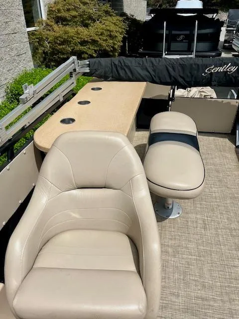 Slide: The Image of 2012 Bentley Pontoons 250/253 Party Cruise interior with beige seating and table. - 11