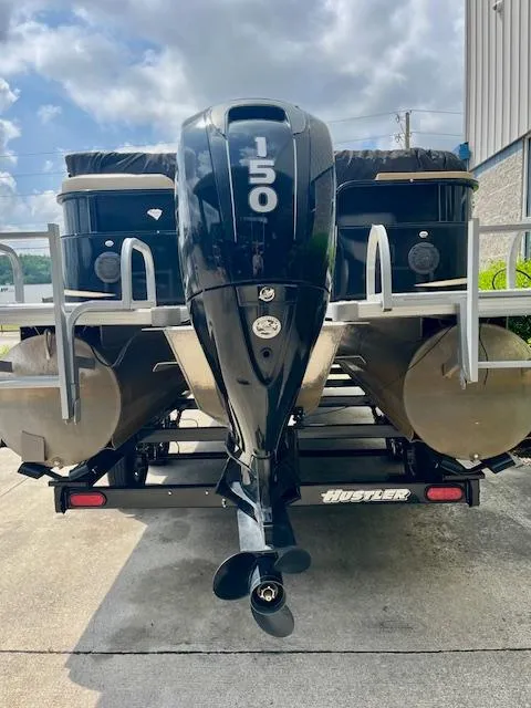 Slide: The Image of 2012 Bentley Pontoons 250/253 Party Cruise with 150 HP engine on trailer. - 2