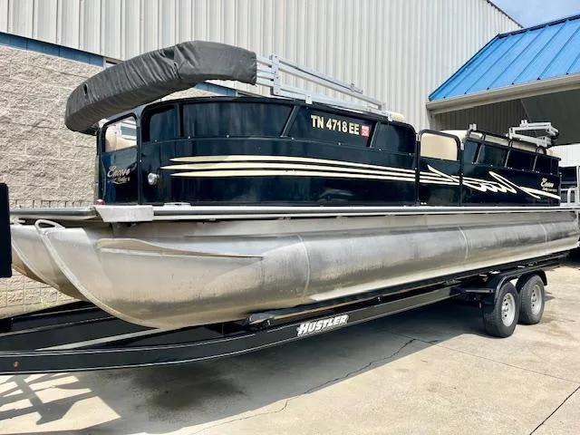 Slide: The Image of 2012 Bentley Pontoons 250/253 Party Cruise on trailer, parked outdoors. - 3