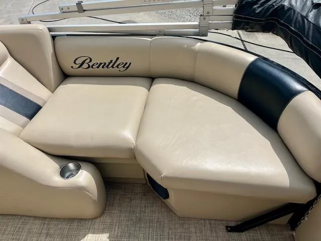 Slide: The Image of 2012 Bentley Pontoons 250/253 Party Cruise seating area with beige and black upholstery. - 8