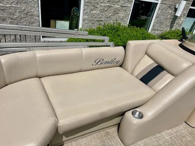 Slide: The Image of 2012 Bentley Pontoons 250/253 Party Cruise with beige seating and cup holder. - 9