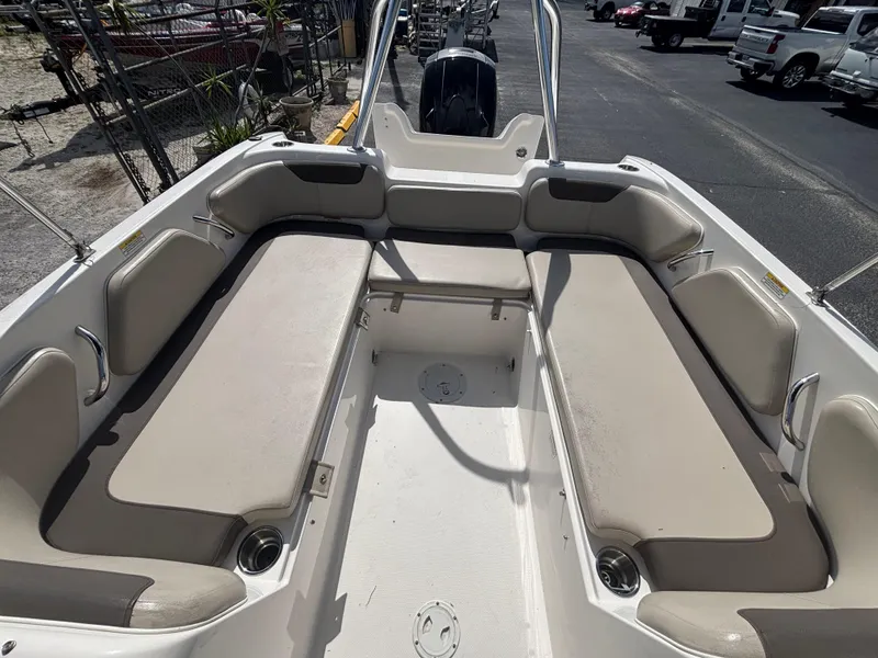 Slide: The Image of 2018 Bayliner Element F21 boat interior with spacious seating and cup holders. - 38