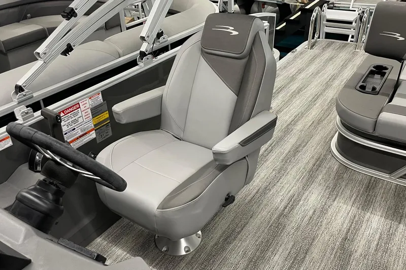 Slide: The Image of Captain's chair in 2025 Bennington 23 SSB pontoon boat, featuring sleek design and modern upholstery. - 10