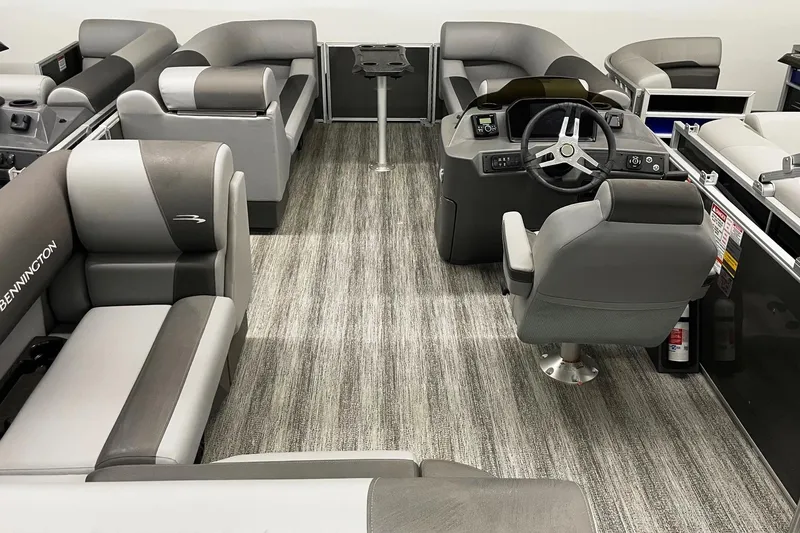 Slide: The Image of 2025 Bennington 23 SSB boat interior with modern seating and steering console. - 4