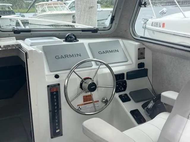 Slide: The Image of 2021 Parker 2520 XLD Sport Cabin helm with Garmin navigation systems. - 16
