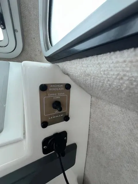 Slide: The Image of Anchor windlass control switch in a 2021 Parker 2520 XLD Sport Cabin boat interior. - 28