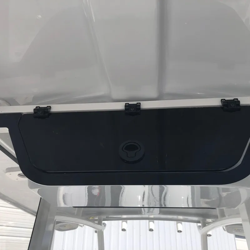 Slide: The Image of 2026 Pair Customs 24 Center Console DV boat interior storage compartment. - 10