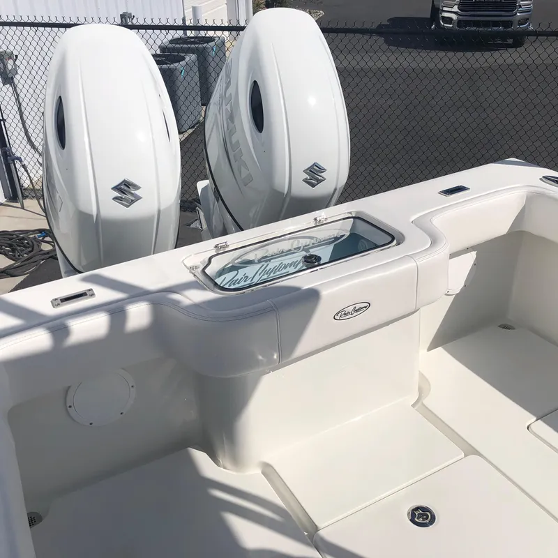 Slide: The Image of 2026 Pair Customs 24 Center Console DV boat with dual Suzuki outboard engines. - 12