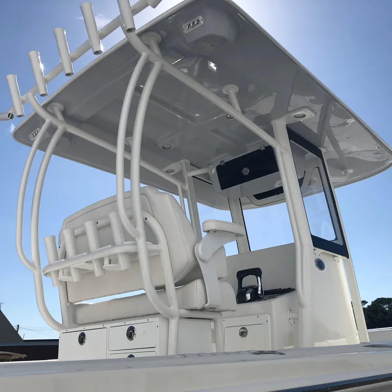 Slide: The Image of 2026 Pair Customs 24 Center Console DV boat with T-top and seating. - 14