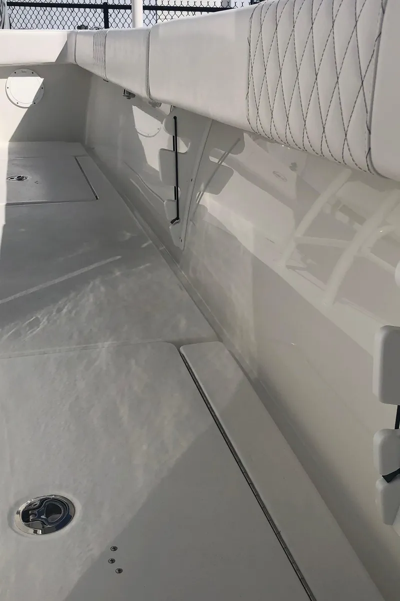 Slide: The Image of 2026 Pair Customs 24 Center Console DV boat interior with quilted seating and sleek design. - 30