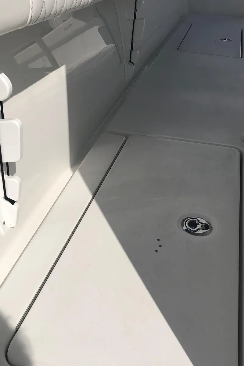 Slide: The Image of 2026 Pair Customs 24 Center Console DV boat interior, featuring sleek white deck design. - 31