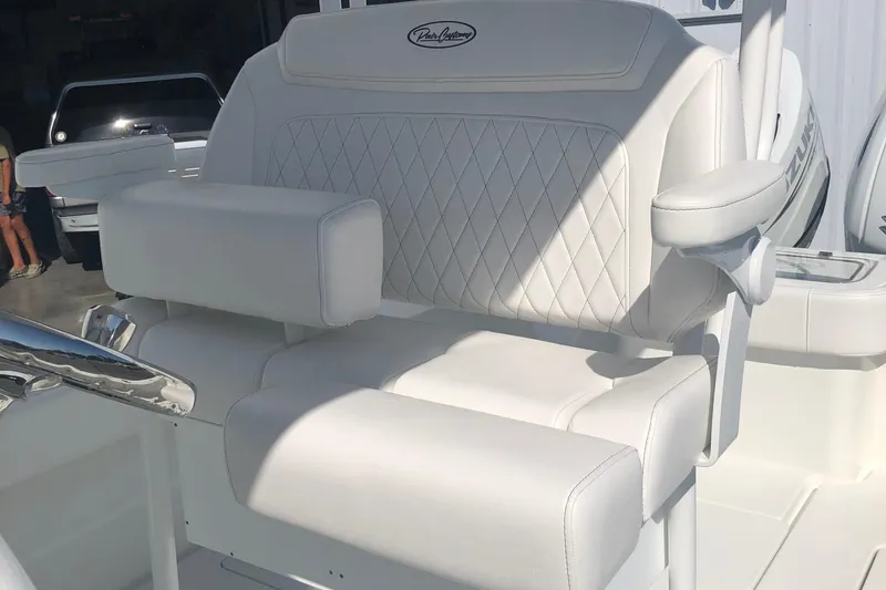 Slide: The Image of Luxurious white seating on 2026 Pair Customs 24 Center Console DV boat. - 33