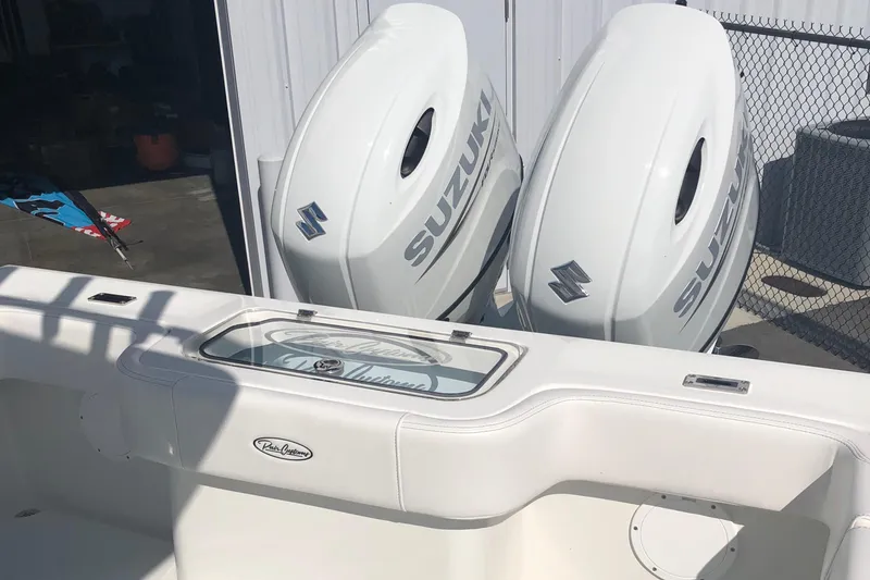 Slide: The Image of 2026 Pair Customs 24 Center Console DV with dual Suzuki outboard engines. - 34