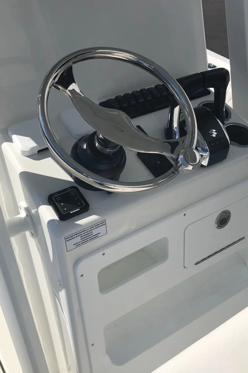 Slide: The Image of 2026 Pair Customs 24 Center Console DV steering wheel and controls. - 35