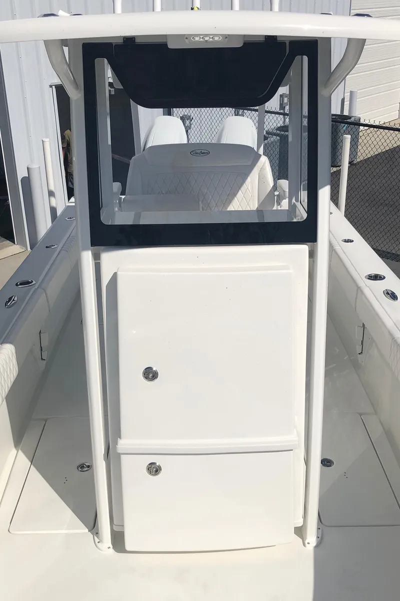Slide: The Image of 2026 Pair Customs 24 Center Console DV boat with sleek white design and modern console. - 39
