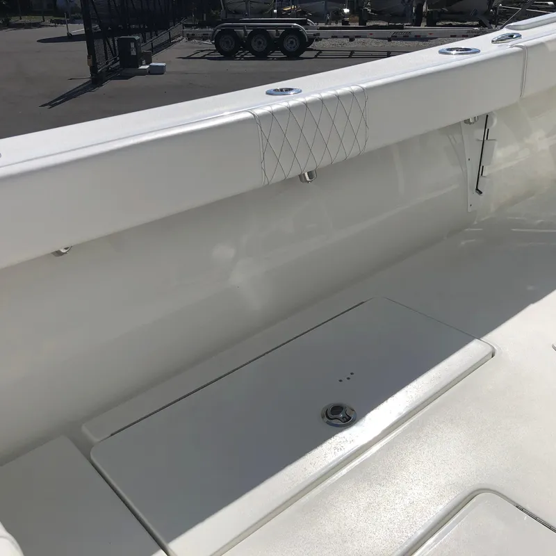 Slide: The Image of 2026 Pair Customs 24 Center Console DV boat interior with sleek white finish. - 4