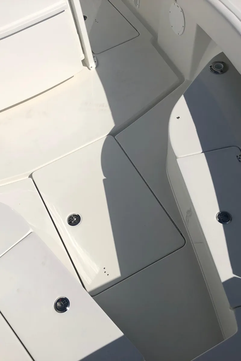 Slide: The Image of 2026 Pair Customs 24 Center Console DV boat interior with sleek white deck design. - 40