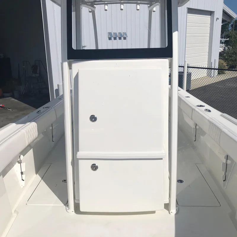Slide: The Image of 2026 Pair Customs 24 Center Console DV boat interior, featuring sleek white design and spacious layout. - 9