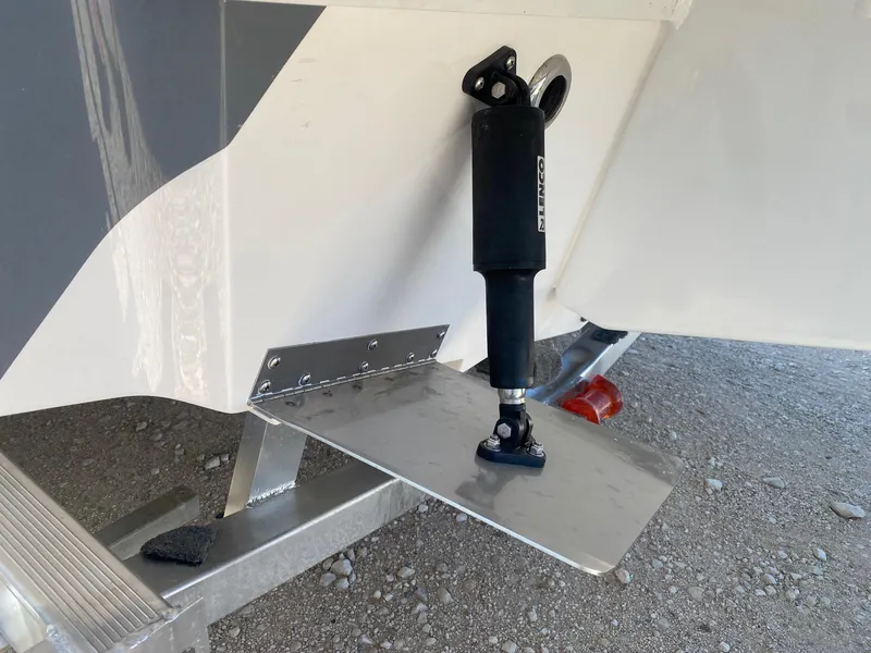 Slide: The Image of 2025 Blazer Bay 2400 Open Bay Striper boat with trim tab detail. - 10