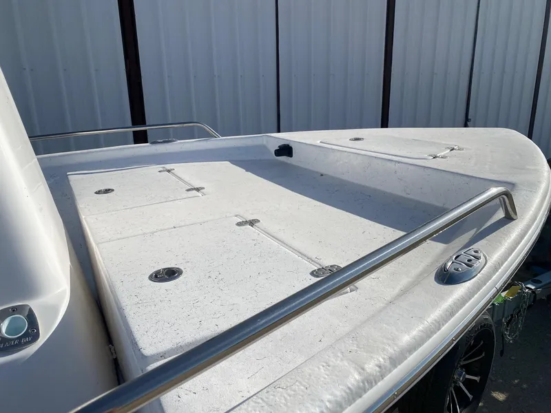 Slide: The Image of 2025 Blazer Bay 2400 Open Bay Striper boat deck with stainless steel railings. - 16