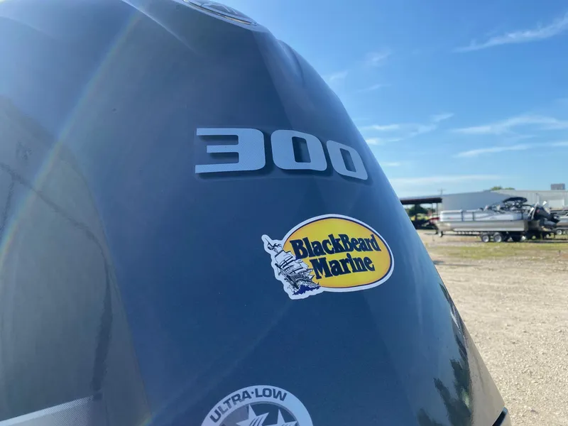 Slide: The Image of Close-up of a 2025 Blazer Bay 2400 Open Bay Striper engine with BlackBeard Marine sticker. - 5